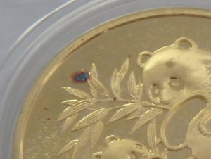 Chinese Gold Panda Coin Red Dot Defect